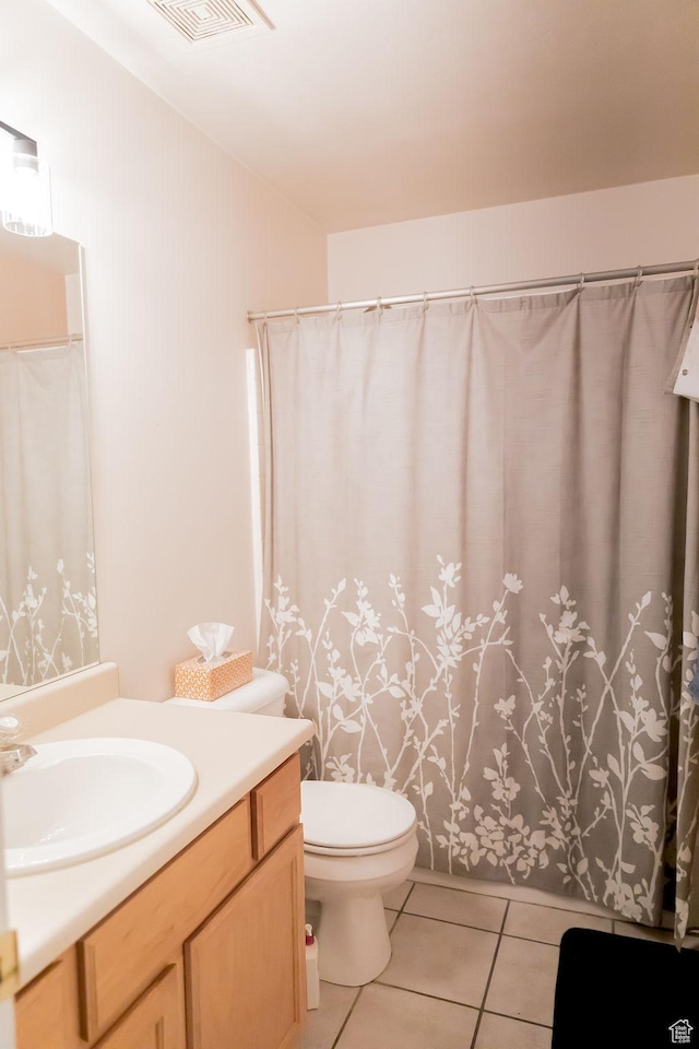 4112 W 4645 S, West Valley City, UT 84120 - full bathroom with visible vents, toilet, tile patterned flooring, and vanity