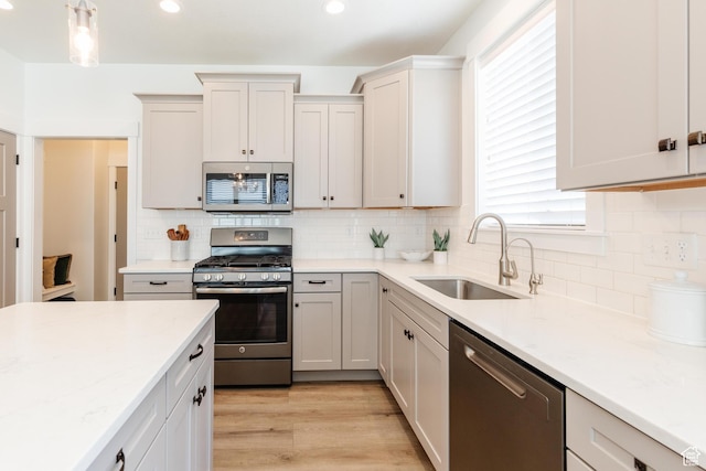 1076 E 300 S, Smithfield, UT 84335 - kitchen with recessed lighting, a sink, appliances with stainless steel finishes, and a healthy amount of sunlight