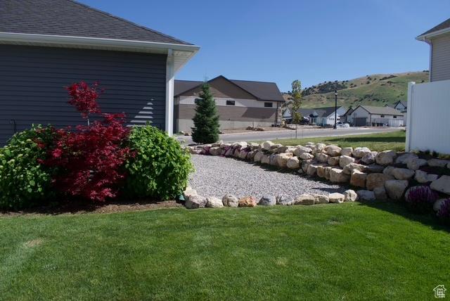 1076 E 300 S, Smithfield, UT 84335 - view of yard featuring a mountain view and a residential view