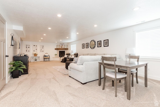 1076 E 300 S, Smithfield, UT 84335 - carpeted living area featuring recessed lighting, visible vents, and a fireplace with raised hearth