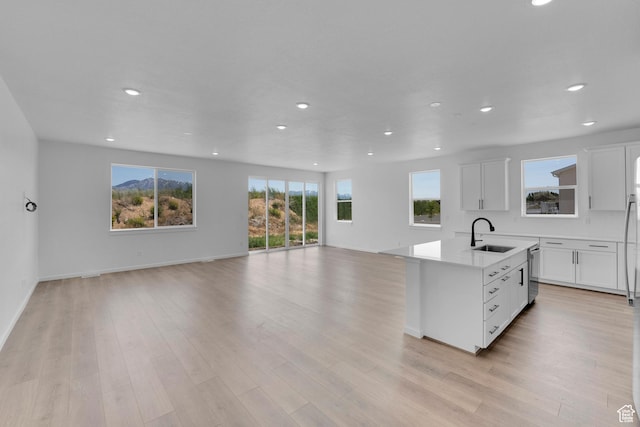 2074 S 3940 W Unit 11, Taylor, UT 84401 - kitchen with open floor plan, recessed lighting, stainless steel dishwasher, a center island with sink, and white cabinetry