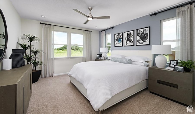 2074 S 3940 W Unit 11, Taylor, UT 84401 - bedroom with light colored carpet, baseboards, and ceiling fan