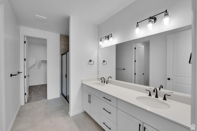2074 S 3940 W Unit 11, Taylor, UT 84401 - full bathroom with a stall shower, double vanity, a spacious closet, and tile patterned floors