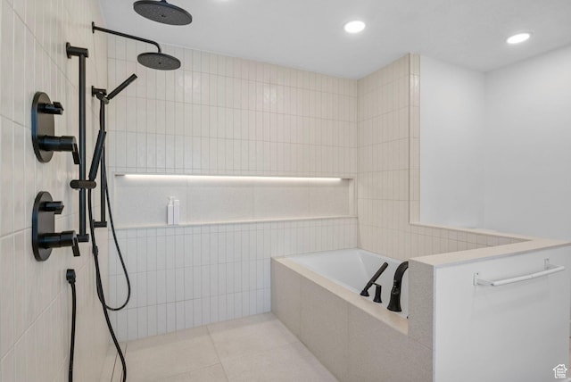 bathroom with walk in shower, recessed lighting, a garden tub, and tile walls