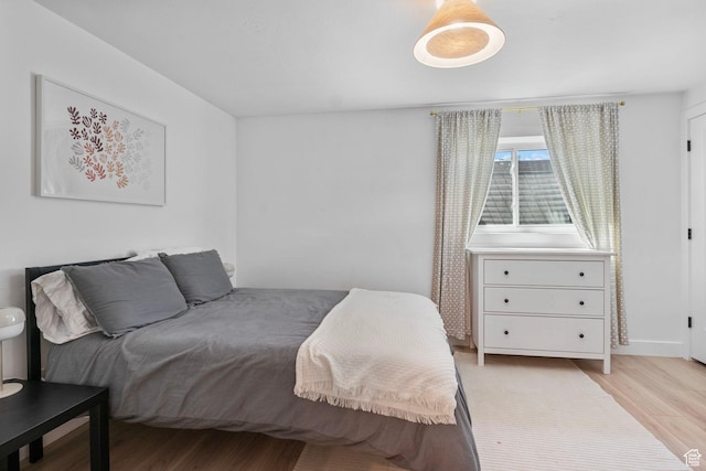 bedroom featuring light wood-style floors