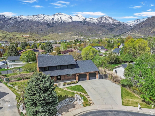 drone / aerial view featuring a mountain view and a residential view