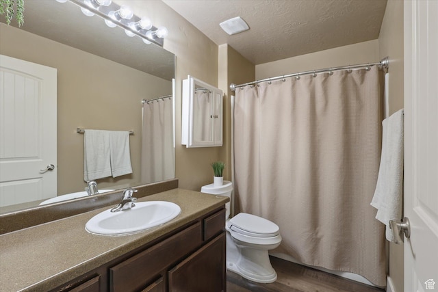 2153 N Springtime Dr, Saratoga Springs, UT 84045 - bathroom featuring vanity, toilet, a textured ceiling, wood finished floors, and a shower with shower curtain