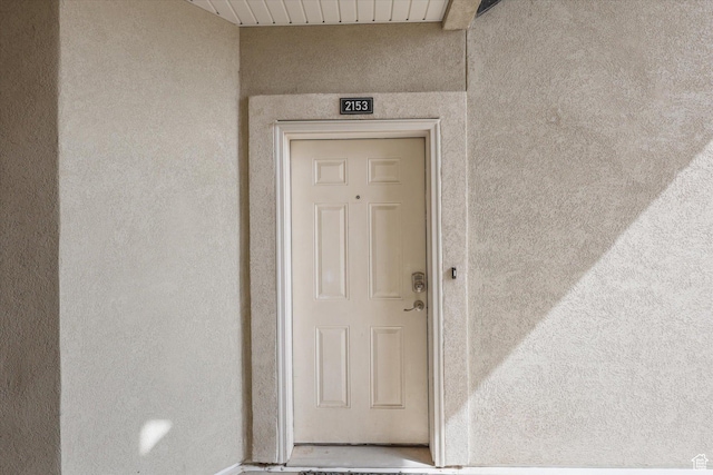 2153 N Springtime Dr, Saratoga Springs, UT 84045 - doorway to property with stucco siding