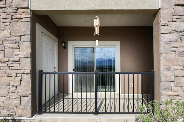 2153 N Springtime Dr, Saratoga Springs, UT 84045 - doorway to property featuring stucco siding and stone siding