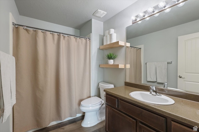 2153 N Springtime Dr, Saratoga Springs, UT 84045 - full bathroom featuring toilet, a textured ceiling, wood finished floors, and vanity