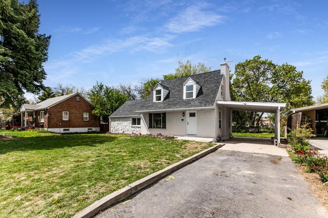 263 N 100 E, Springville, UT 84663 - view of front of property with a chimney, brick siding, a carport, driveway, and a front yard