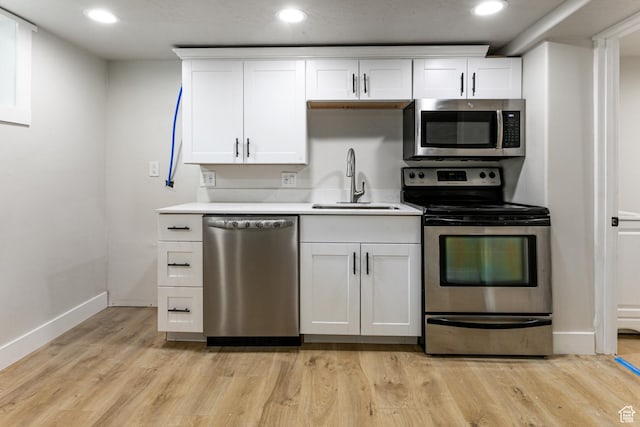 263 N 100 E, Springville, UT 84663 - kitchen featuring recessed lighting, stainless steel appliances, light countertops, white cabinets, and a sink