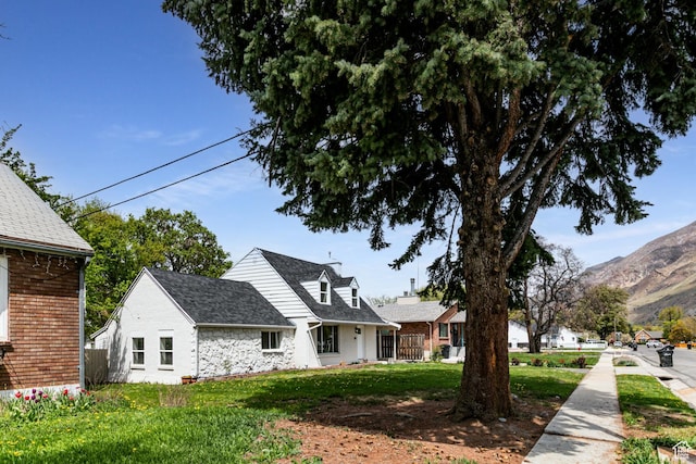 263 N 100 E, Springville, UT 84663 - exterior space featuring roof with shingles, a front yard, and a mountain view