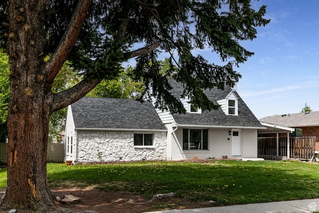263 N 100 E, Springville, UT 84663 - view of front of property with fence, a shingled roof, a front yard, and stone siding