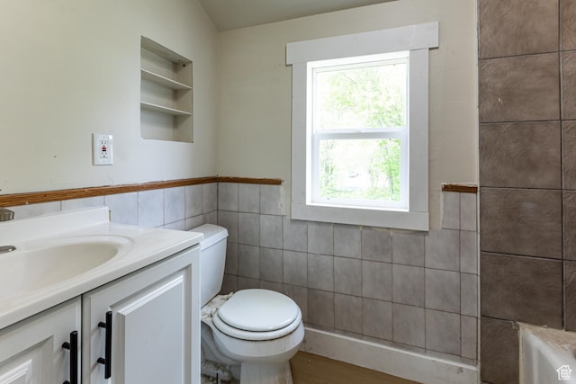 263 N 100 E, Springville, UT 84663 - bathroom featuring tile walls, a wealth of natural light, toilet, and vanity
