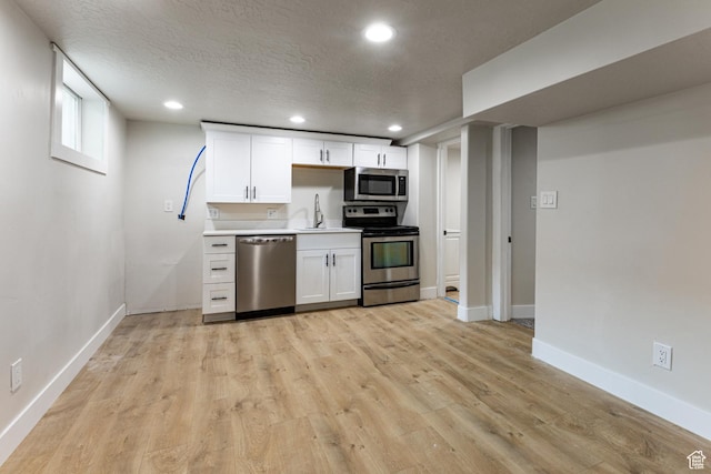 263 N 100 E, Springville, UT 84663 - kitchen featuring appliances with stainless steel finishes, white cabinetry, recessed lighting, and baseboards