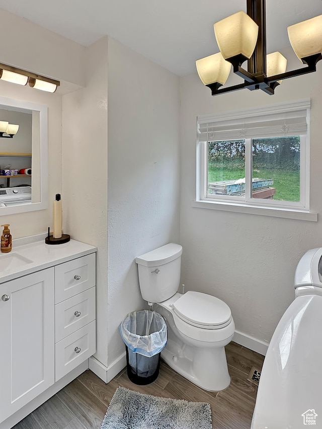 886 E Hillcrest Dr, Springville, UT 84663 - half bathroom with wood finished floors, toilet, vanity, and baseboards