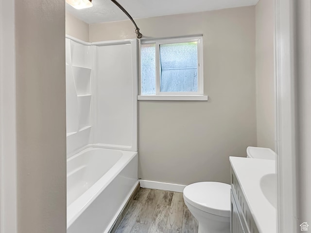 886 E Hillcrest Dr, Springville, UT 84663 - bathroom featuring wood finished floors, bathtub / shower combination, toilet, vanity, and baseboards