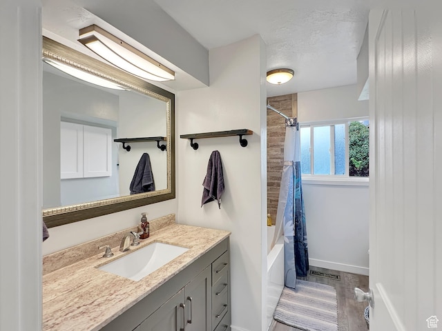 886 E Hillcrest Dr, Springville, UT 84663 - full bath featuring baseboards, shower / tub combo, wood finished floors, and vanity