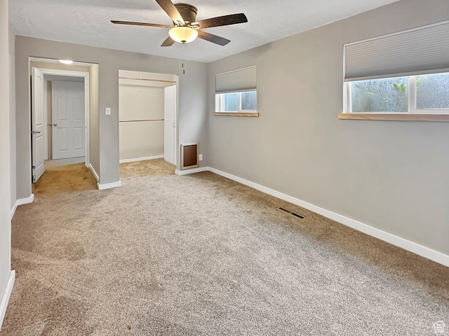 886 E Hillcrest Dr, Springville, UT 84663 - unfurnished bedroom featuring ceiling fan, visible vents, a closet, baseboards, and carpet floors