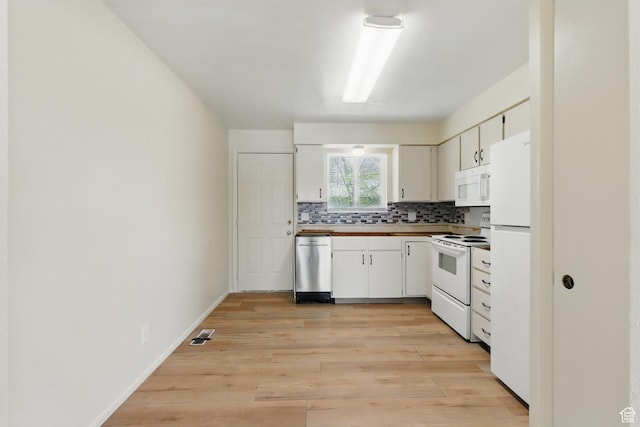 985 S 600 W, Provo, UT 84601 - kitchen featuring light wood-type flooring, white appliances, white cabinets, and backsplash
