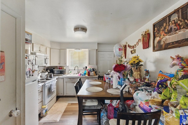 985 S 600 W, Provo, UT 84601 - kitchen with white appliances, light countertops, and a sink