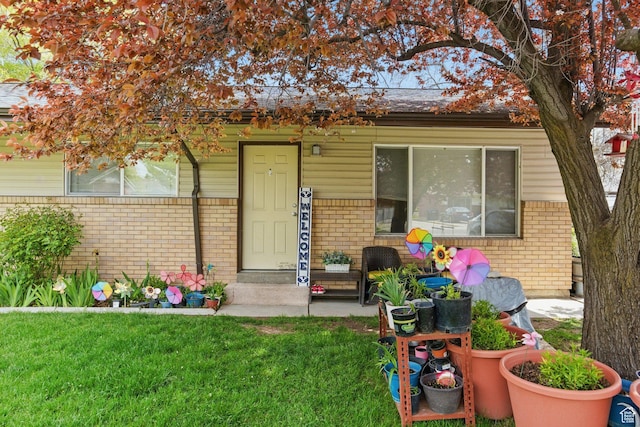 985 S 600 W, Provo, UT 84601 - entrance to property with a lawn and brick siding