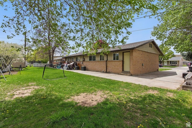 985 S 600 W, Provo, UT 84601 - rear view of property with a lawn and brick siding