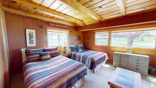 315 Abbey Rd, Moab, UT 84532 - carpeted bedroom with wooden ceiling, multiple windows, beam ceiling, and wooden walls