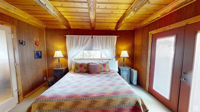 315 Abbey Rd, Moab, UT 84532 - bedroom with beam ceiling, wood ceiling, wooden walls, and light carpet