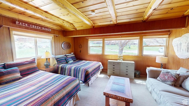 315 Abbey Rd, Moab, UT 84532 - carpeted bedroom featuring wood ceiling, multiple windows, wooden walls, and beam ceiling