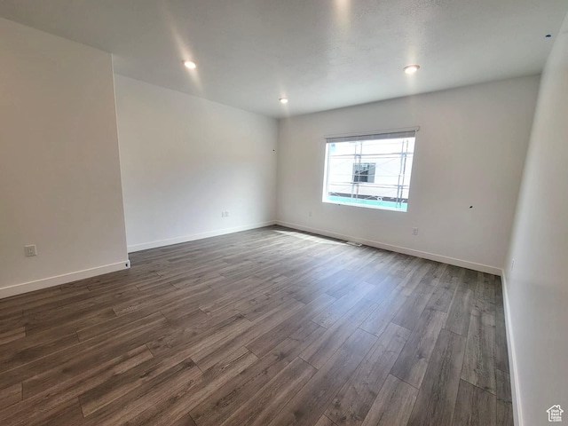 1146 W 310 S, American Fork, UT 84003 - spare room featuring dark wood-style flooring, recessed lighting, and baseboards