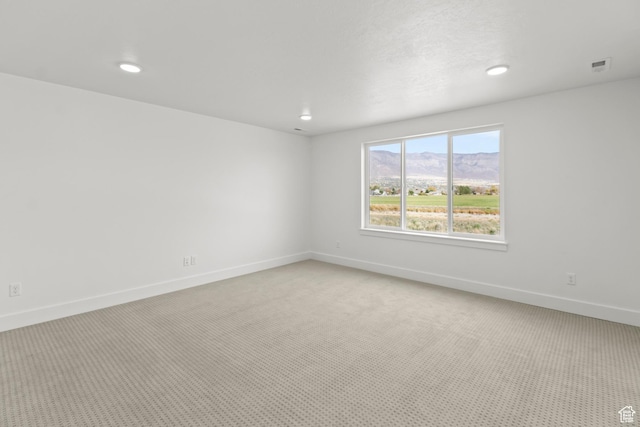 2372 W 2950 N Unit 108, Farr West, UT 84404 - unfurnished room featuring light colored carpet, visible vents, recessed lighting, and baseboards