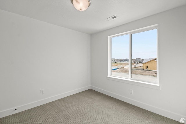 2372 W 2950 N Unit 108, Farr West, UT 84404 - empty room featuring visible vents, light carpet, and baseboards