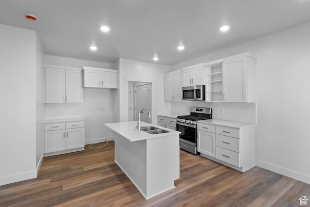 kitchen with a sink, open shelves, tasteful backsplash, white cabinetry, and appliances with stainless steel finishes