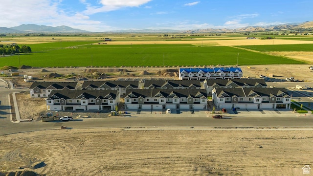 birds eye view of property with a rural view and a mountain view