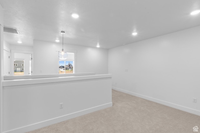 interior space featuring recessed lighting, visible vents, and baseboards