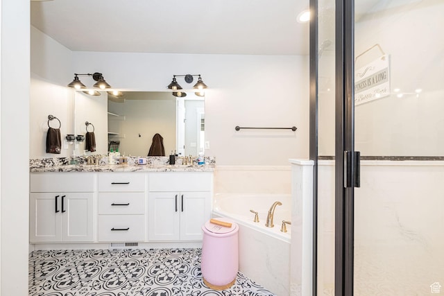 9568 N 5600 W, Elwood, UT 84337 - full bath featuring tile patterned flooring, a shower stall, double vanity, visible vents, and a garden tub