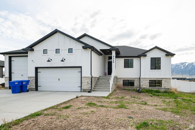 9568 N 5600 W, Elwood, UT 84337 - modern farmhouse featuring board and batten siding, concrete driveway, and stone siding