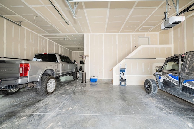 9568 N 5600 W, Elwood, UT 84337 - garage featuring a garage door opener