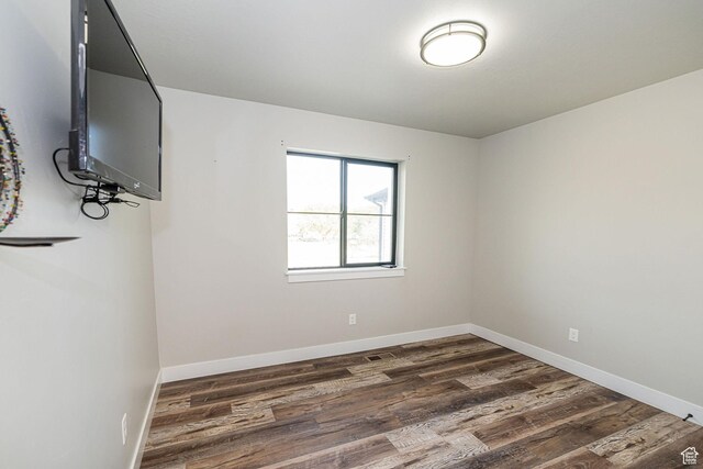 9568 N 5600 W, Elwood, UT 84337 - unfurnished room featuring visible vents, dark wood finished floors, and baseboards