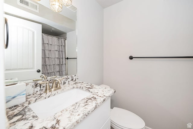 9568 N 5600 W, Elwood, UT 84337 - full bathroom featuring toilet, visible vents, vanity, and baseboards