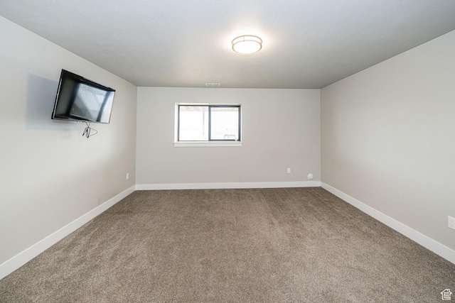 9568 N 5600 W, Elwood, UT 84337 - spare room with visible vents, carpet, and baseboards