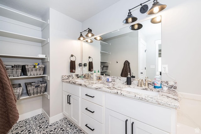 9568 N 5600 W, Elwood, UT 84337 - bathroom with double vanity, tile patterned flooring, and a sink