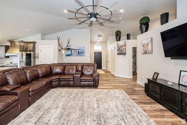 9568 N 5600 W, Elwood, UT 84337 - living room with ceiling fan, baseboards, lofted ceiling, and light wood-type flooring
