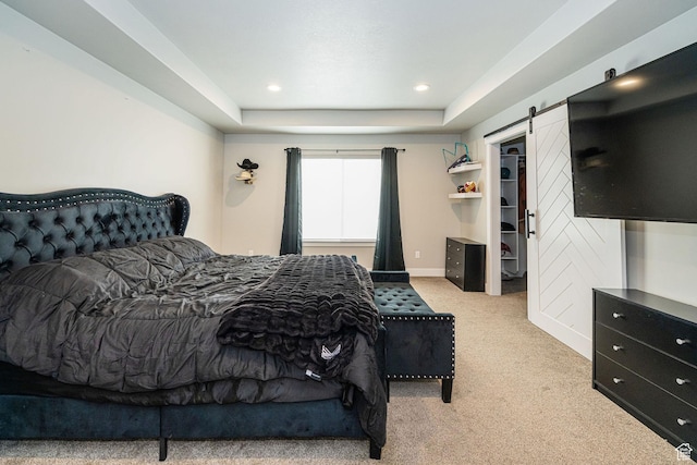 9568 N 5600 W, Elwood, UT 84337 - carpeted bedroom featuring a barn door, a raised ceiling, and recessed lighting