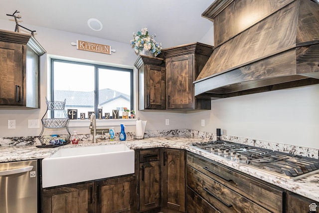 9568 N 5600 W, Elwood, UT 84337 - kitchen with dark brown cabinets, custom range hood, appliances with stainless steel finishes, and a sink