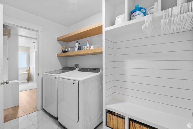 2862 S Preening Way, Saratoga Springs, UT 84045 - clothes washing area featuring washing machine and dryer, marble finish floor, and laundry area