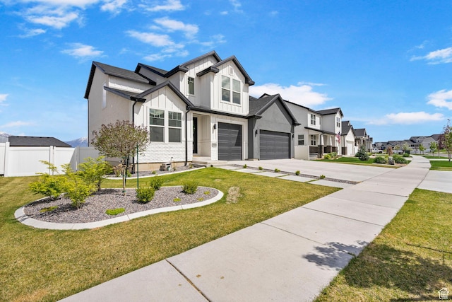 2862 S Preening Way, Saratoga Springs, UT 84045 - modern inspired farmhouse featuring a front yard, a residential view, board and batten siding, concrete driveway, and fence