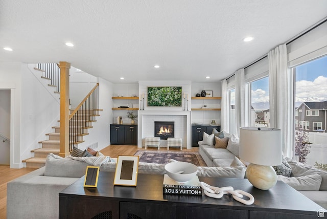 2862 S Preening Way, Saratoga Springs, UT 84045 - living area featuring light wood finished floors, stairs, and recessed lighting